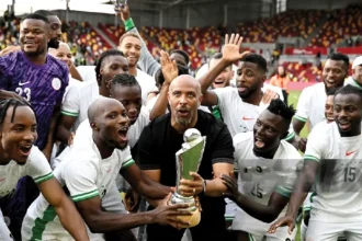 Super Eagles players celebrating Unity cup trophy