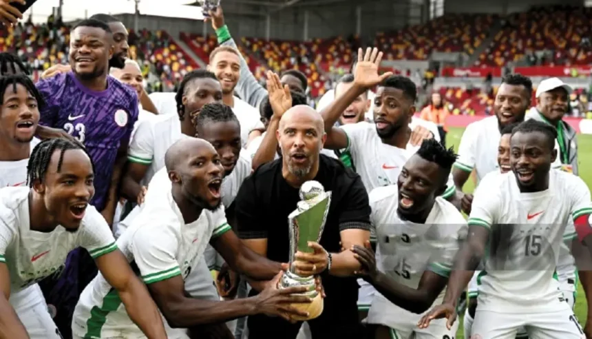Super Eagles players celebrating Unity cup trophy