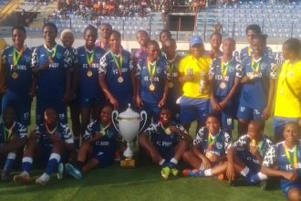 Robo Queens players with their FA cup trophy